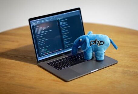 Concurrent Programming - blue elephant figurine on macbook pro