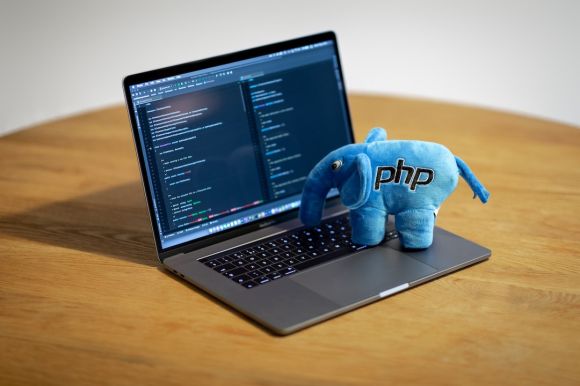 Concurrent Programming - blue elephant figurine on macbook pro